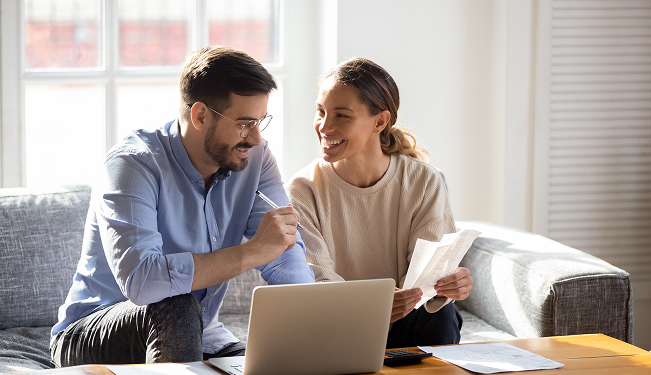 Graduate reviewing a student loan repayment schedule
