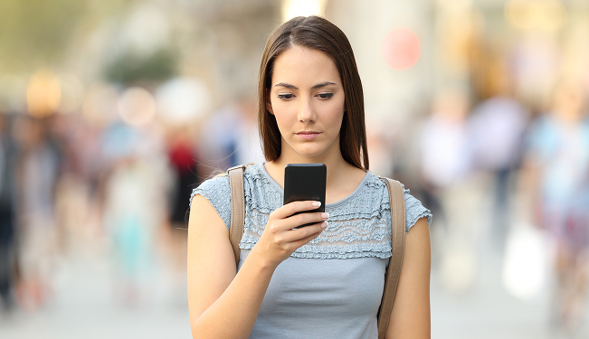 Worried student reading a loan denial letter