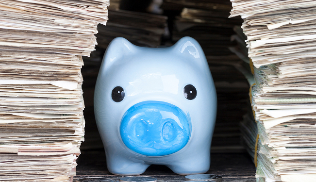 Student calculating unexpected college expenses on a calculator