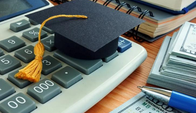 Student reviewing a tuition bill and cost of attendance breakdown